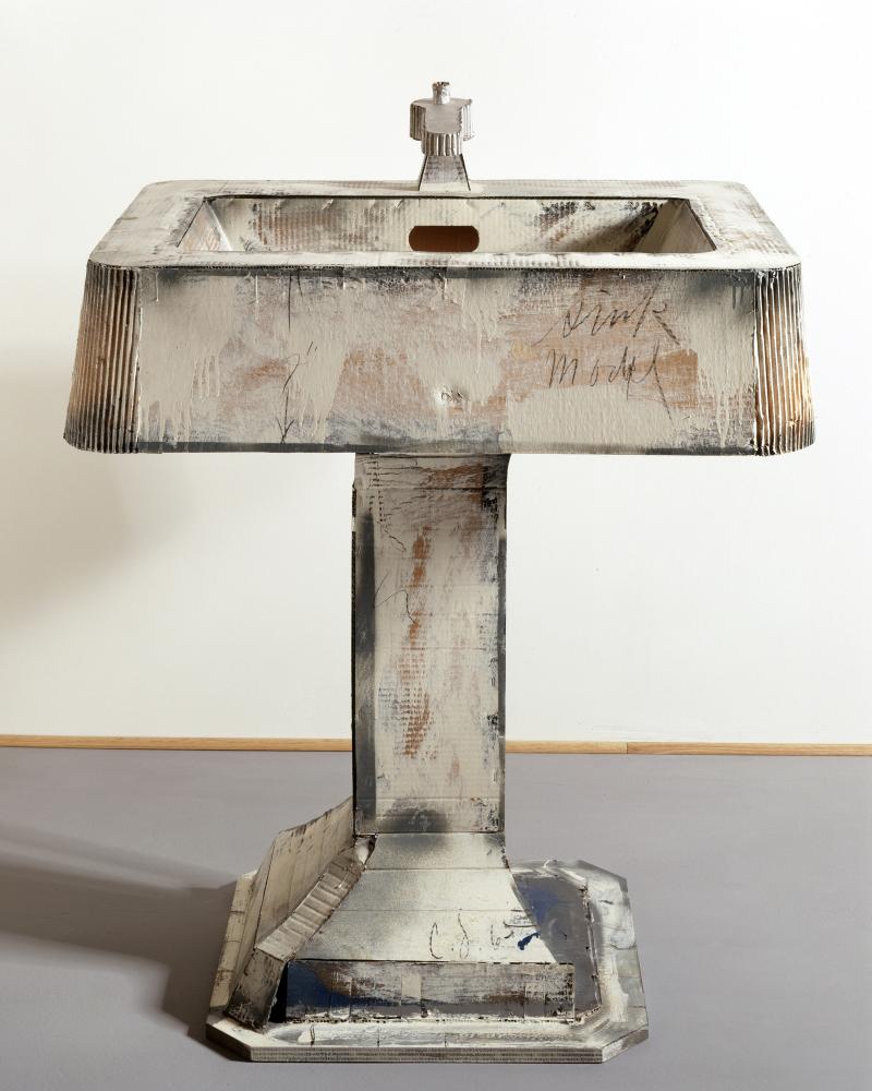 Oldenburg_Washstand (Hard Model).jpg Washstand - Hard Model, 1965-66 Enamel, spray enamel, and felt pen on cardboard; wood/Lack, Sprühlack und Filzstift auf Pappe, Holz 123 x 91,5 x 74,5 cm Museum für Moderne Kunst, Frankfurt am Main (ehemalige Sammlung Karl Ströher, Darmstadt), Foto: Rudolf Nagel, Frankfurt am Main © Claes Oldenburg