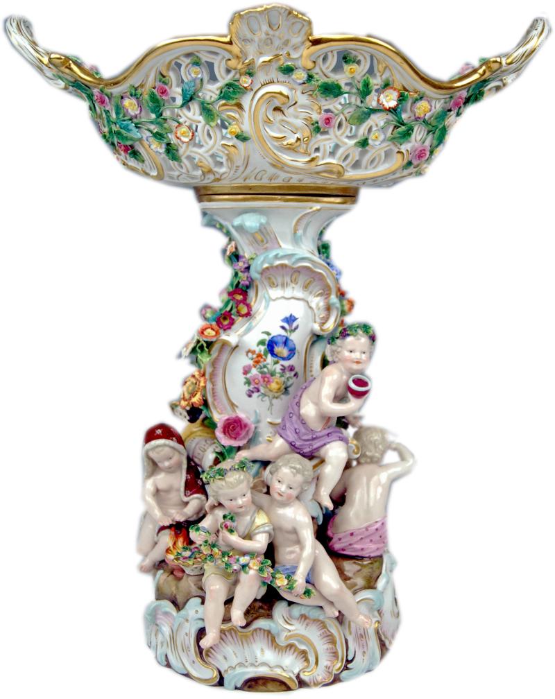 MEISSEN  JAHRESZEITEN  TAFELAUFSATZ Winter, Sommer, Frühling und Herbst mit zweihenkeliger Korbschale, zahlreiche plastische Blumenblüten, Goldstaffierung und gemalter Blumendekor, um 1860, Höhe:  44 cm (city antik/Kunsthandel, Wien)