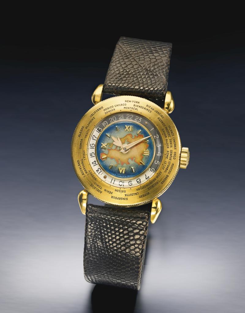 Lot 213 Patek Philippe An Extremely Rare Yellow Gold World Time Wristwatch With Enamel Dial Depicting Eurasia Ref 1415 Mvt 964808 Case 669495 Made In 1949 Est. $600/1.2 million Sold for $ 730,000