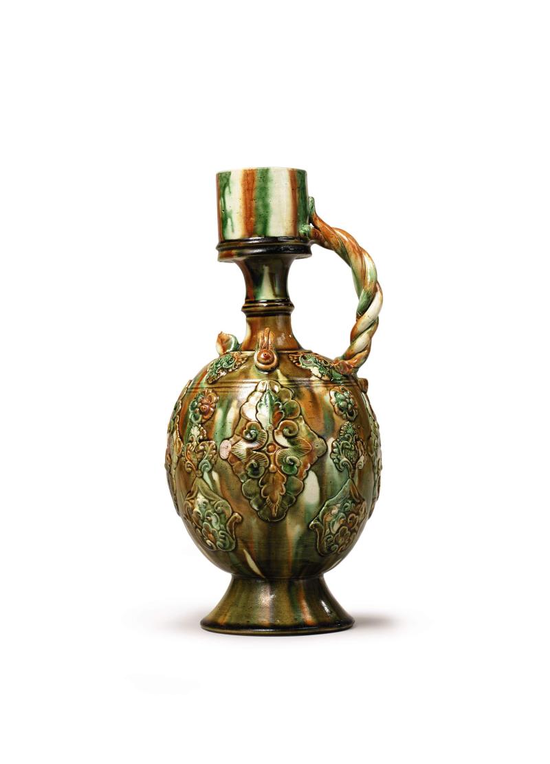 Lot 6 A Magnificent Sancai-Glazed Ewer Tang Dynasty Height 11 7/8  in., 30.1 cm Estimate $500/700,000