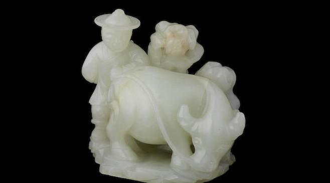 An exceptionally rare pale green jade farmer and buffalo group, 18th century, estimated at £40,000-60,000