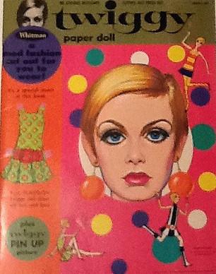 Enchanted Books A blast from the past, this paper doll version of fashion icon Twiggy is delightful. Making this extra nice - it includes a separate free-standing cardboard die-cut of Twiggy wearing the "Plastilon" dress - advertising the "Twiggy Paper Doll Book plus a Mod Fashion that You Can Wear!