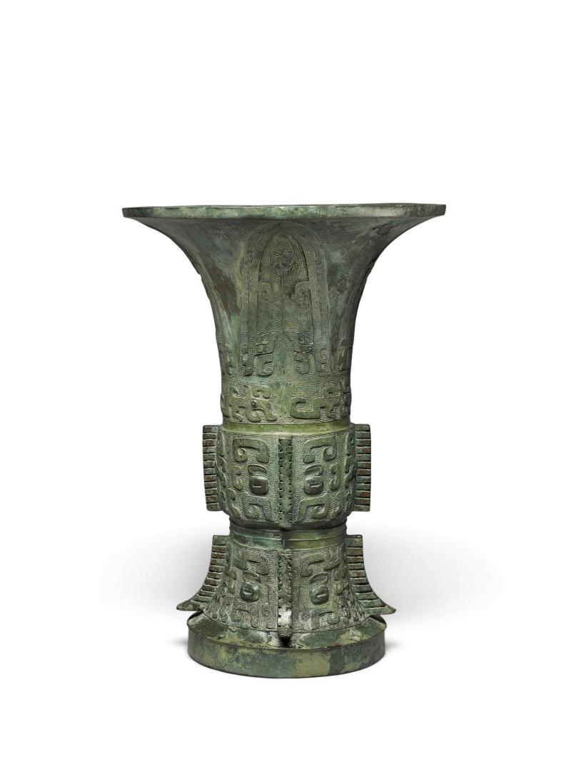 Lot 183 An Archaic Bronze Ritual Vessel (Zun)  Shang Dynasty, Yinxu Period Height 13 5/8 in., 34.6 cm Estimate $650/850,0