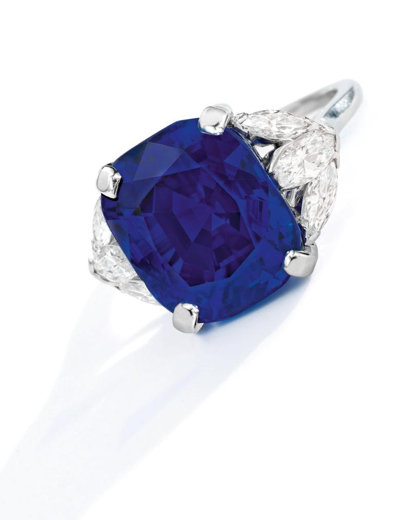 Lot 142 Property from a Family Collection, Texas An Exceptional Sapphire and Diamond Ring Set with a cushion-cut sapphire weighing 16.46 carats, flanked on either side by three marquise-shaped diamonds, Estimate $1.3/1.8 million Sold for $1,815,000