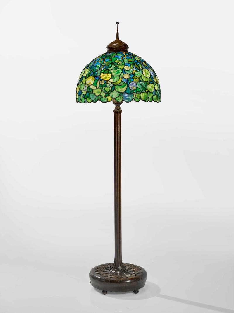 Lot 305 Property from an Important American Collection Tiffany Studios An Important "Snowball" Floor Lamp with a "Scroll" Senior floor base and "Pig Tail" finial shade inscribed twice with Walter P. Chrysler, Jr., accession number GAT 82.53 base impressed Tiffany Studios/NEW YORK/375 leaded glass, patinated bronze 78 in. (198.1 cm) high 24 3/4 in. (62.9 cm) diameter of shade circa 1905-1910 Estimate $500/700,000