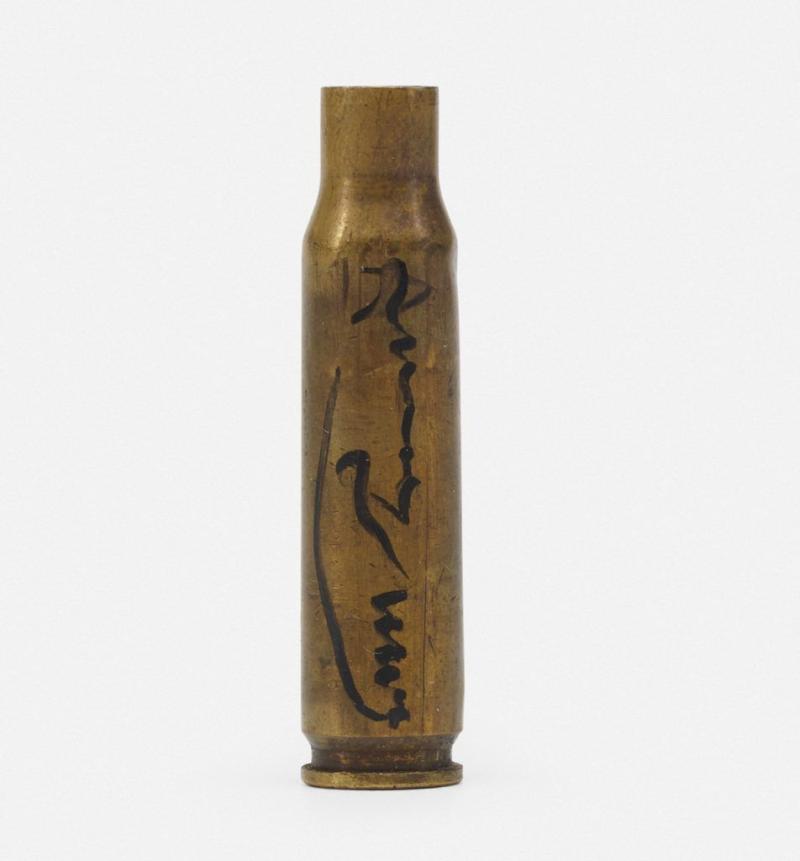 A brass bullet signed by Andy Warhol. Photo: Courtesy of Schubertiade