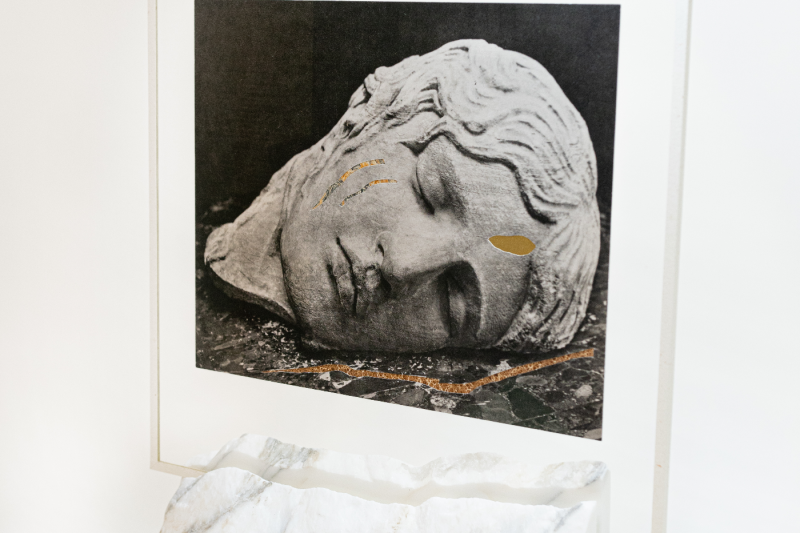 Blandine Chambost, Sleeping Erinyes (Detail), 2022, Collage inlaid with gilded and antique marbled paper on a Carrara marble base, 30 x 34 x 10 cm. Courtesy of Stuart Lochhead Sculpture