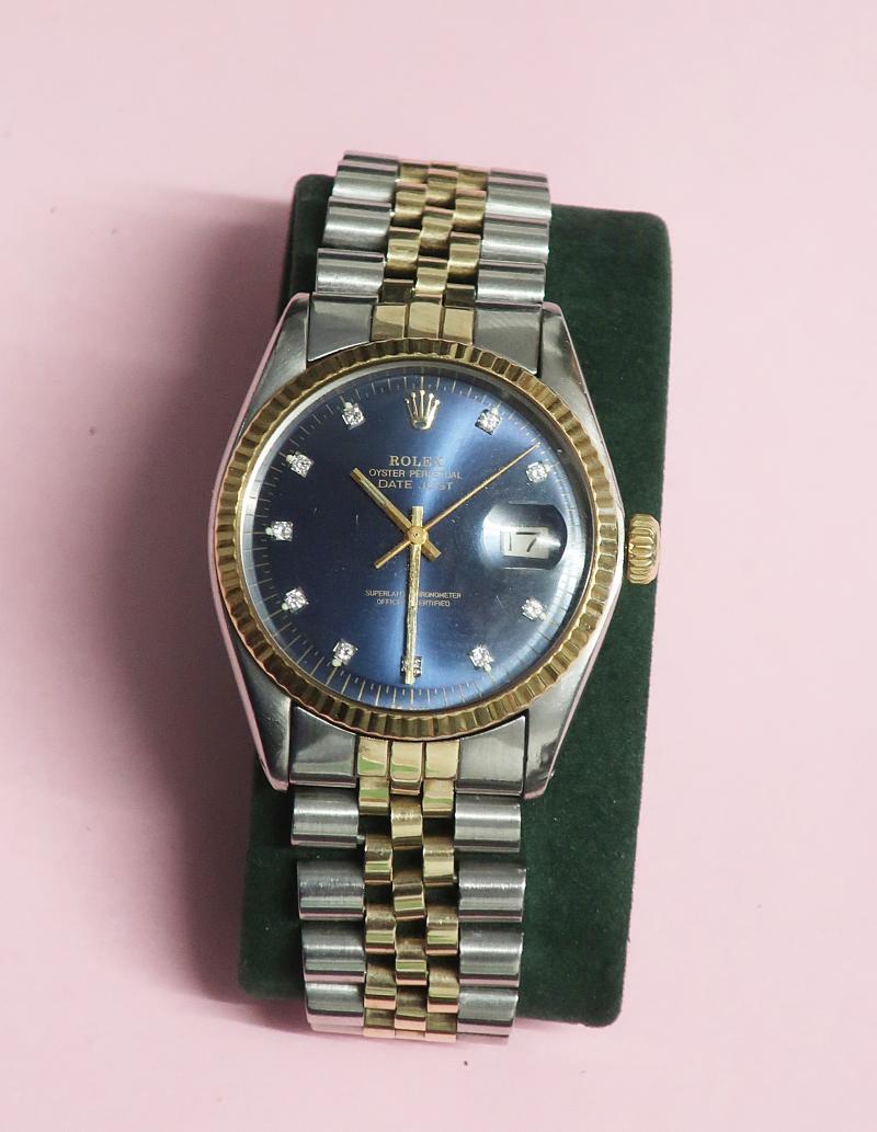 Herrenarmbanduhr Marke Rolex, Model Oyster Perpetual Date mit blauem Ziffernblatt und Diamantbesatz, Gelbgold/Edelstahl