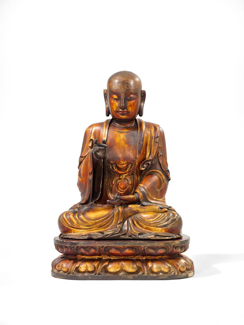 Buddha. Holz mit vergoldeter Lackfassung. 18. Jh. H gesamt 84 cm Schätzpreis € 60/80.000